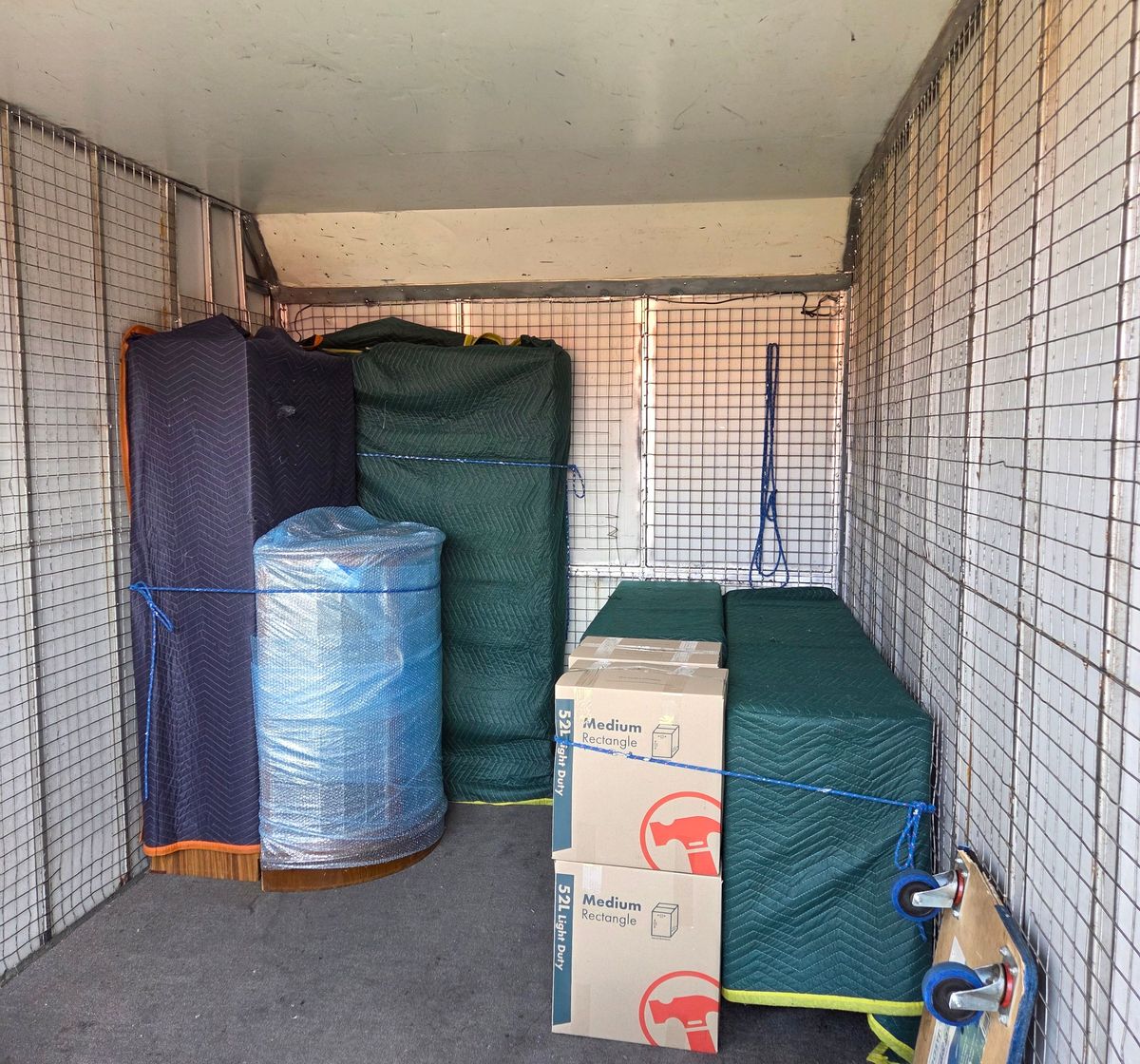 Truck loaded with blanket wrapped furniture and boxes